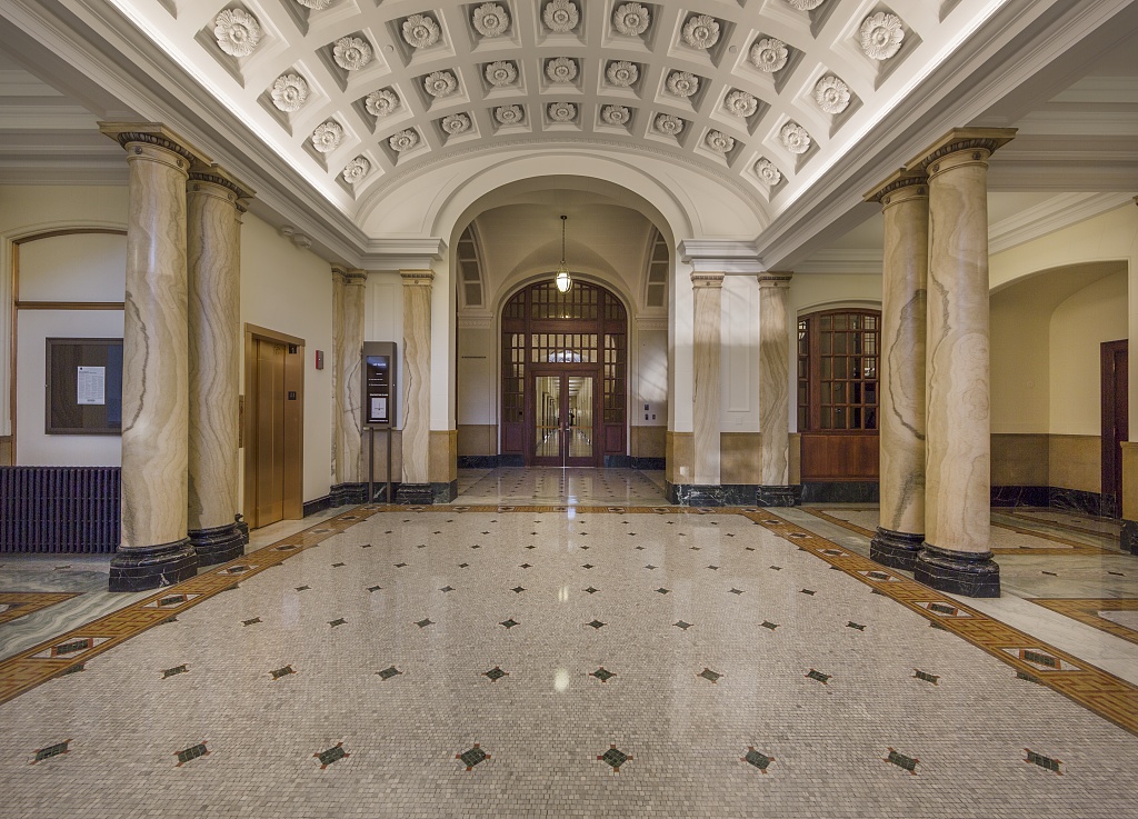 Historic federal building lobby with marble columns maintained under IEI facility operations